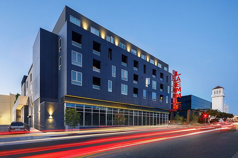 building with a dark exterior and illuminated windows